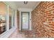 Charming front door flanked by large windows, offering a glimpse of the interior at 6575 E 171St St, Noblesville, IN 46062