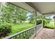 View from the covered porch of a well-maintained lawn and mature trees at 6575 E 171St St, Noblesville, IN 46062