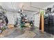 View of the spacious garage with storage shelves, a fridge and open floor space at 6575 E 171St St, Noblesville, IN 46062