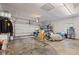 View of the spacious garage with storage shelves, overhead lighting, and open floor space at 6575 E 171St St, Noblesville, IN 46062