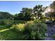 Beautiful flower garden and verdant trees at 6575 E 171St St, Noblesville, IN 46062