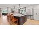 Modern kitchen features a large center island with granite countertop and stainless steel appliances at 6575 E 171St St, Noblesville, IN 46062