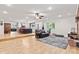 Open layout seamlessly connects the kitchen, dining, and living areas, with fireplace and hardwood floors at 6575 E 171St St, Noblesville, IN 46062