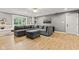 Comfortable living room with a large sectional sofa, built-in shelving, and bright natural light at 6575 E 171St St, Noblesville, IN 46062