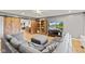 Spacious living room with sliding barn doors, comfortable sectional sofa, and entertainment center at 6575 E 171St St, Noblesville, IN 46062