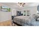 Bright main bedroom with a ceiling fan, access to a private outdoor area, and an ensuite bathroom at 6575 E 171St St, Noblesville, IN 46062