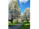 Scenic paved walking path shaded by blossoming trees at 6575 E 171St St, Noblesville, IN 46062