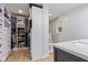 Functional walk-in closet and adjacent bathroom featuring organized storage and a stylish vanity at 6575 E 171St St, Noblesville, IN 46062