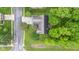 Birds-eye view featuring a cozy home with mature trees, a backyard deck, and a well-maintained lawn at 6980 White Oak Dr, Avon, IN 46123