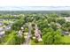 A high-angle view captures a charming neighborhood lined with mature trees and well-maintained homes at 6980 White Oak Dr, Avon, IN 46123