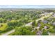 Aerial shot of homes in a lush, green neighborhood with mature trees lining the streets at 6980 White Oak Dr, Avon, IN 46123