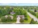 Aerial view of a charming home with mature trees, a well-kept yard, and a two-car garage at 6980 White Oak Dr, Avon, IN 46123