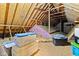 Spacious attic featuring wooden beams, insulation, and ample storage space for belongings at 6980 White Oak Dr, Avon, IN 46123