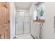 Bright bathroom featuring a glass enclosed shower with a window at 6980 White Oak Dr, Avon, IN 46123