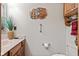 Bathroom featuring marble countertop, wood cabinets, and decorative owl art for a unique touch at 6980 White Oak Dr, Avon, IN 46123