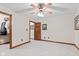 This bedroom has a connecting door to a large closet and neutral colored walls and carpet at 6980 White Oak Dr, Avon, IN 46123