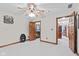 Bedroom with an open door to a walk-in closet and view of the hallway at 6980 White Oak Dr, Avon, IN 46123