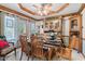 Charming dining room featuring custom woodwork, a ceiling fan, and a spacious layout at 6980 White Oak Dr, Avon, IN 46123