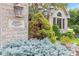 Close up of the home's address plaque with lush landscaping and architectural detail of the facade at 6980 White Oak Dr, Avon, IN 46123