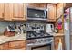 A gourmet kitchen with stainless steel appliances and granite countertops at 6980 White Oak Dr, Avon, IN 46123