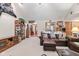 Spacious living room with wood accents, leather furniture, and a display cabinet at 6980 White Oak Dr, Avon, IN 46123