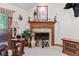 Cozy living room featuring a wooden fireplace mantel and nature-themed decor at 6980 White Oak Dr, Avon, IN 46123