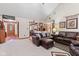 Spacious living room featuring a fireplace, comfortable seating, and seamless transition to other areas at 6980 White Oak Dr, Avon, IN 46123