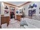 Bright main bathroom featuring a tub, vanity and walk-in closet at 6980 White Oak Dr, Avon, IN 46123