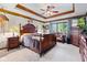 A serene main bedroom with dark wood accents and plenty of natural light at 6980 White Oak Dr, Avon, IN 46123