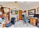 Comfortable home office with wood trim and built-ins and TV at 6980 White Oak Dr, Avon, IN 46123