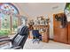 This home office features vaulted ceilings, a custom stained-glass window, and vintage built-in desk at 6980 White Oak Dr, Avon, IN 46123
