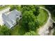 Aerial view of home with large lot, mature trees and golf course at 7106 Royal Oakland Dr, Indianapolis, IN 46236