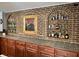 Home bar with dark wood cabinetry, tile countertop, and brick backsplash with unique decor at 7106 Royal Oakland Dr, Indianapolis, IN 46236