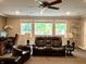 This finished basement features three large windows, furniture, and desk area at 7106 Royal Oakland Dr, Indianapolis, IN 46236
