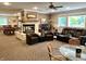 This finished basement features multiple couches, a fireplace, pool table and an entertainment center at 7106 Royal Oakland Dr, Indianapolis, IN 46236