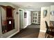 Basement hallway features a bar area, ample storage, and neutral walls, offering a versatile space at 7106 Royal Oakland Dr, Indianapolis, IN 46236