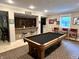 This finished basement features a pool table, wet bar, and furniture at 7106 Royal Oakland Dr, Indianapolis, IN 46236