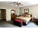 Charming bedroom with a ceiling fan, warm accents, and closet access, creating a peaceful and inviting space at 7106 Royal Oakland Dr, Indianapolis, IN 46236