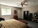 Serene bedroom with a ceiling fan, natural light, and spacious layout, offering a comfortable retreat at 7106 Royal Oakland Dr, Indianapolis, IN 46236