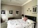 Bedroom featuring modern artwork and a vintage sewing machine table at 7106 Royal Oakland Dr, Indianapolis, IN 46236