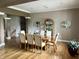 Spacious dining room with wood floors, neutral colors and stylish design at 7106 Royal Oakland Dr, Indianapolis, IN 46236