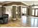 Spacious entryway featuring hardwood floors, double doors, and open access to other living spaces at 7106 Royal Oakland Dr, Indianapolis, IN 46236