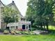 Exterior view featuring a balcony, screened in porch and fire pit area at 7106 Royal Oakland Dr, Indianapolis, IN 46236