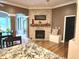 Living room featuring a brick fireplace with a wooden mantel and decorative accents at 7106 Royal Oakland Dr, Indianapolis, IN 46236