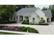 Charming front exterior featuring a beautifully landscaped yard and a well-maintained lawn at 7106 Royal Oakland Dr, Indianapolis, IN 46236