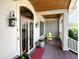Elegant front porch boasting wood ceilings, stone accents, and comfortable seating area at 7106 Royal Oakland Dr, Indianapolis, IN 46236
