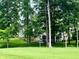 Charming home with lush landscaping, and a well-manicured lawn, perfect for outdoor enjoyment at 7106 Royal Oakland Dr, Indianapolis, IN 46236