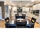 Open-concept kitchen with white cabinets, stainless steel appliances, and a large island for entertaining at 7106 Royal Oakland Dr, Indianapolis, IN 46236