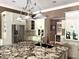 Kitchen featuring a central island with granite countertop, ample storage, and barstool seating at 7106 Royal Oakland Dr, Indianapolis, IN 46236