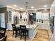 Spacious kitchen featuring a large island with granite countertops and modern stainless steel appliances at 7106 Royal Oakland Dr, Indianapolis, IN 46236